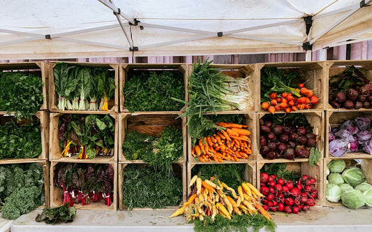 Fresh June Ontario produce including strawberries, asparagus, radishes, and salad greens in a wooden basket — Freshever GTA delivery