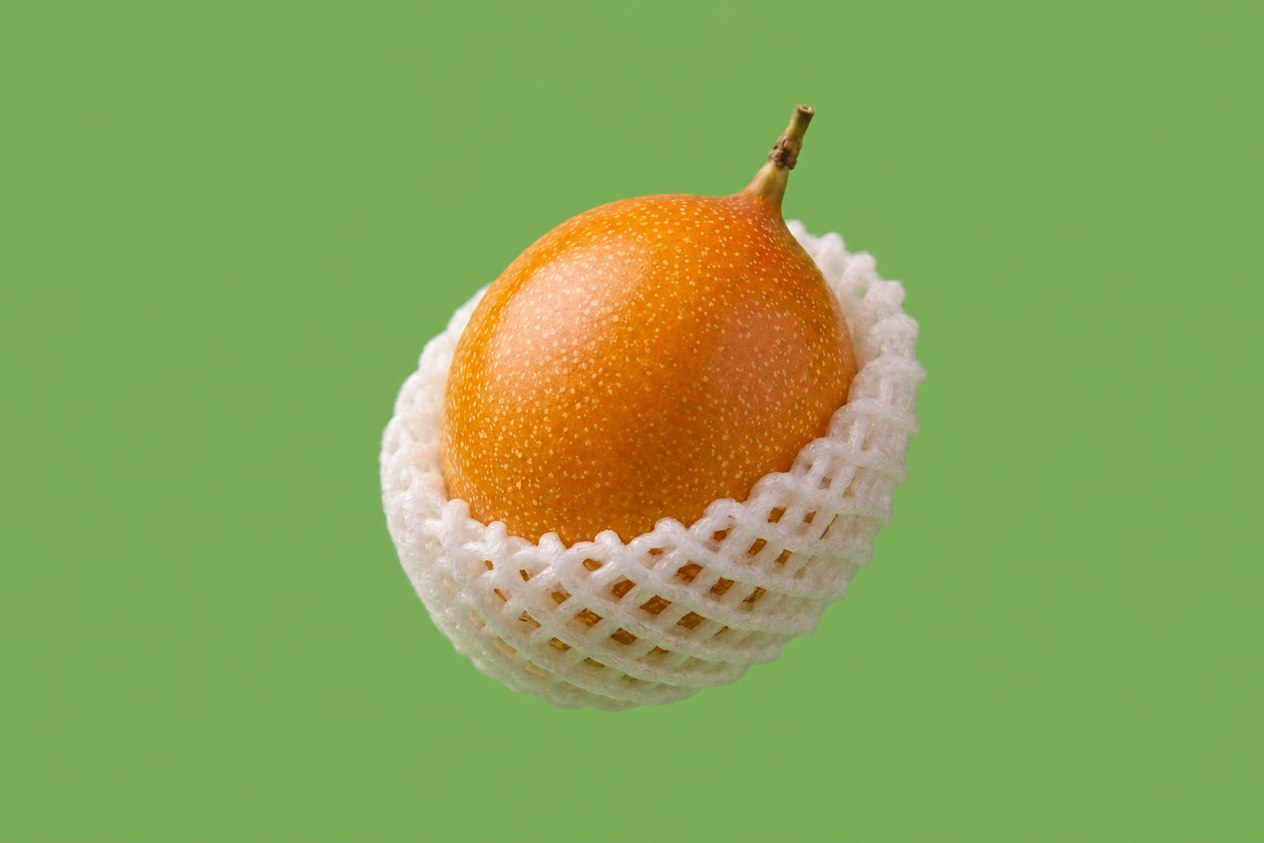 Granadilla passion fruit cut open showing juicy aromatic seed pulp, fresh delivery Toronto GTA