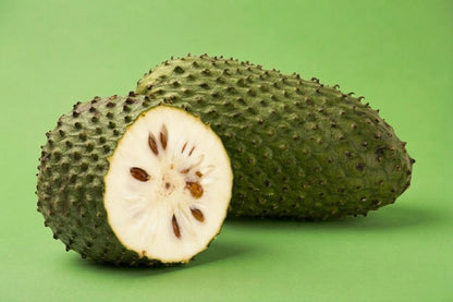 Soursop cut open showing creamy white flesh and seeds, fresh guanabana Toronto fruit delivery