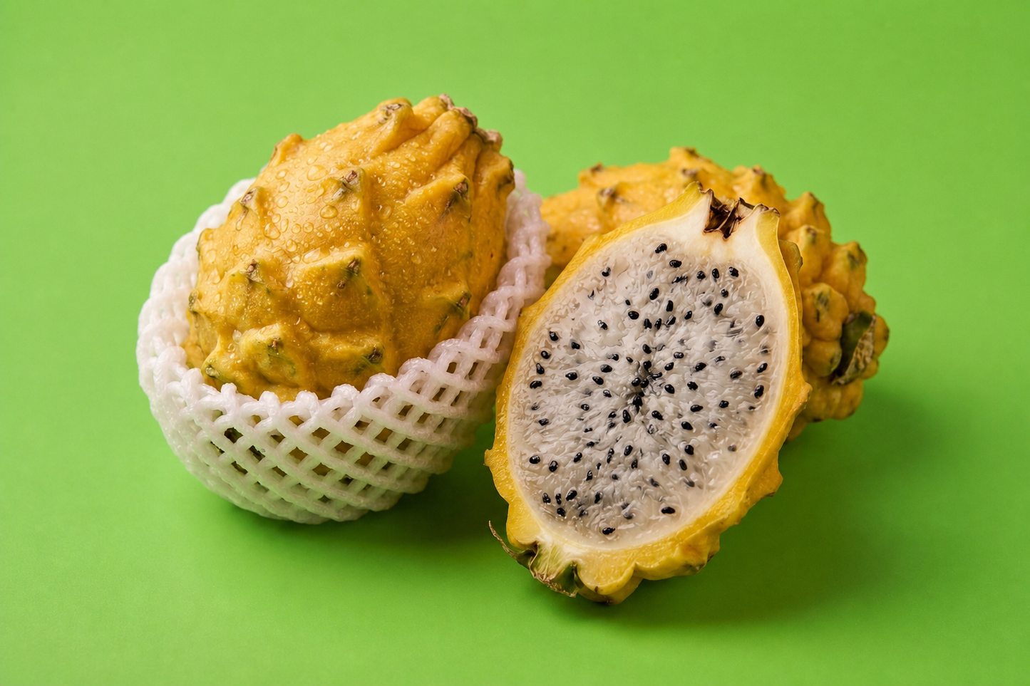 Yellow Dragon Fruit sliced showing white flesh and edible black seeds